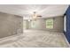 Spacious main bedroom with neutral color and two ceiling fans at 5761 E Emerald Oaks Ln, Acworth, GA 30102