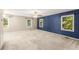 Spacious main bedroom features lots of natural light and neutral carpeting at 5761 E Emerald Oaks Ln, Acworth, GA 30102