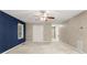 Spacious main bedroom with neutral carpet and blue accent wall at 5761 E Emerald Oaks Ln, Acworth, GA 30102