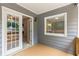 Covered back patio with access to home's interior and outdoor view at 5761 E Emerald Oaks Ln, Acworth, GA 30102