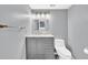 Modern bathroom featuring a vanity with marble countertop, sleek fixtures, and updated toilet at 7307 Cardigan Cir, Sandy Springs, GA 30328