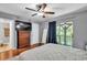 Bedroom with ceiling fan, ensuite access, and queen sized bed at 7307 Cardigan Cir, Sandy Springs, GA 30328