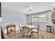 Cozy dining area with round table, wood floors, and a charming chandelier at 7307 Cardigan Cir, Sandy Springs, GA 30328