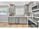 Updated kitchen featuring modern appliances, stylish cabinetry, and bright countertops at 7307 Cardigan Cir, Sandy Springs, GA 30328