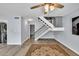 Spacious living room features modern flooring, neutral walls, a decorative rug and a ceiling fan at 7307 Cardigan Cir, Sandy Springs, GA 30328