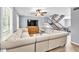 Inviting living room with a plush sectional sofa, modern ceiling fan, and staircase at 7307 Cardigan Cir, Sandy Springs, GA 30328