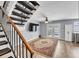 Living room with a staircase, rug, ceiling fan, TV, and access to the backyard through glass doors at 7307 Cardigan Cir, Sandy Springs, GA 30328