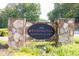 Stone monument sign reading '7070 Stonington Condominiums', welcoming residents and visitors to the community at 7307 Cardigan Cir, Sandy Springs, GA 30328