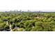 An aerial view showcases a lush, green neighborhood with the city skyline visible in the distance at 80 Vinson Se Dr, Atlanta, GA 30317