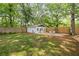 A cute shed/office with a seating area on a large manicured backyard at 80 Vinson Se Dr, Atlanta, GA 30317