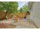 Cozy backyard featuring a brick fire pit, wooden chairs, and a privacy fence at 80 Vinson Se Dr, Atlanta, GA 30317