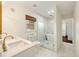 Bright bathroom with double vanity, glass enclosed shower, and marble tile floors at 80 Vinson Se Dr, Atlanta, GA 30317