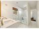 Bright bathroom featuring double sinks, soaking tub and frameless shower at 80 Vinson Se Dr, Atlanta, GA 30317