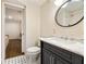 Bathroom featuring black and white tile floor, updated vanity, and an opening to a bedroom at 80 Vinson Se Dr, Atlanta, GA 30317