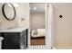 Neutral bathroom with black and white tiled floor, updated vanity, and shower at 80 Vinson Se Dr, Atlanta, GA 30317