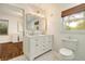 Bright bathroom featuring double sinks, bright vanity and natural light at 80 Vinson Se Dr, Atlanta, GA 30317