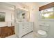 Bright bathroom with marble floors, double vanity, and natural light at 80 Vinson Se Dr, Atlanta, GA 30317
