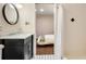 Bathroom with black vanity and a round mirror at 80 Vinson Se Dr, Atlanta, GA 30317
