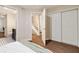 Bedroom view of ensuite bathroom, closet, and staircase with hardwood floors at 80 Vinson Se Dr, Atlanta, GA 30317