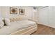 Guest bedroom with hardwood floors, tufted daybed, and sliding closet doors at 80 Vinson Se Dr, Atlanta, GA 30317