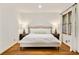 Bright bedroom with hardwood floors, a large window and neutral decor at 80 Vinson Se Dr, Atlanta, GA 30317