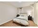 Small bedroom with hardwood floors, neutral walls, and two end tables with lamps at 80 Vinson Se Dr, Atlanta, GA 30317