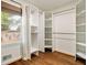 Walk-in closet with custom shelves and window overlooking backyard at 80 Vinson Se Dr, Atlanta, GA 30317