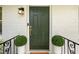 Stylish front door with elegant hardware and design, flanked by lush potted greenery at 80 Vinson Se Dr, Atlanta, GA 30317