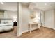 Neutral hallway with accent table, artwork, and doorways to bedroom and closet at 80 Vinson Se Dr, Atlanta, GA 30317