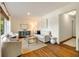 Bright living room boasting hardwood floors, neutral furnishings, and a view of the outdoors through large windows at 80 Vinson Se Dr, Atlanta, GA 30317