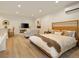Bright and spacious main bedroom featuring hardwood floors, a king-size bed, and a comfortable seating area at 80 Vinson Se Dr, Atlanta, GA 30317