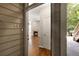 Exterior door opens to hardwood floors, living room with fireplace, and neutral paint at 123 Mcgill Park Ave # 123, Atlanta, GA 30312