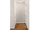 Hallway features wood floors, neutral paint, and white doors on both sides at 123 Mcgill Park Ave # 123, Atlanta, GA 30312