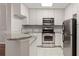 Modern kitchen featuring stainless steel appliances and granite countertops, ready to cook! at 123 Mcgill Park Ave # 123, Atlanta, GA 30312
