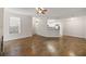 Open floor plan features hardwood floors, ceiling fan, and fireplace in the living room at 123 Mcgill Park Ave # 123, Atlanta, GA 30312