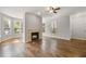 Open living space offers hardwood floors, fireplace, and large windows for natural light at 123 Mcgill Park Ave # 123, Atlanta, GA 30312