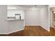 Bright living room featuring hardwood floors and an open floor plan to the kitchen at 123 Mcgill Park Ave # 123, Atlanta, GA 30312