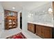 Charming bathroom with double vanity, brick accent wall, and black and white tile floor at 302 Chinquapin Sw Dr, Marietta, GA 30064