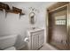 Updated bathroom featuring tiled shower, white vanity and toilet with storage at 302 Chinquapin Sw Dr, Marietta, GA 30064