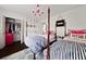 Bedroom with twin beds, walk-in closet, and eclectic decor at 302 Chinquapin Sw Dr, Marietta, GA 30064