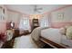 Cozy bedroom featuring a vintage bed frame, pastel colors, and lots of natural light at 302 Chinquapin Sw Dr, Marietta, GA 30064