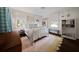 Bright bedroom with a white metal bed frame, hardwood floors, and sunny windows at 302 Chinquapin Sw Dr, Marietta, GA 30064