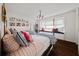 Bright bedroom featuring two twin beds and a window seat with drawers at 302 Chinquapin Sw Dr, Marietta, GA 30064
