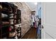 Walk-in closet with custom shelving and a brick accent wall providing ample storage at 302 Chinquapin Sw Dr, Marietta, GA 30064