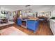 Open-concept kitchen featuring a central island, stainless steel appliances, and seamless connection to the living area at 302 Chinquapin Sw Dr, Marietta, GA 30064