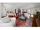 Spacious living room with hardwood floors, comfortable seating, and access to the outdoors at 302 Chinquapin Sw Dr, Marietta, GA 30064
