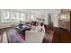 Bright living room with large windows, hardwood floors, and elegant furnishings at 302 Chinquapin Sw Dr, Marietta, GA 30064