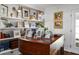 Living room featuring a piano and custom shelves adorned with books and decor at 302 Chinquapin Sw Dr, Marietta, GA 30064
