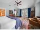 Bright main bedroom featuring hardwood floors, French doors, and stylish furnishings at 302 Chinquapin Sw Dr, Marietta, GA 30064