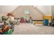 Spacious attic area with natural light from a window, ready for storage or renovation at 474 Boxelder Rd, Atlanta, GA 30349